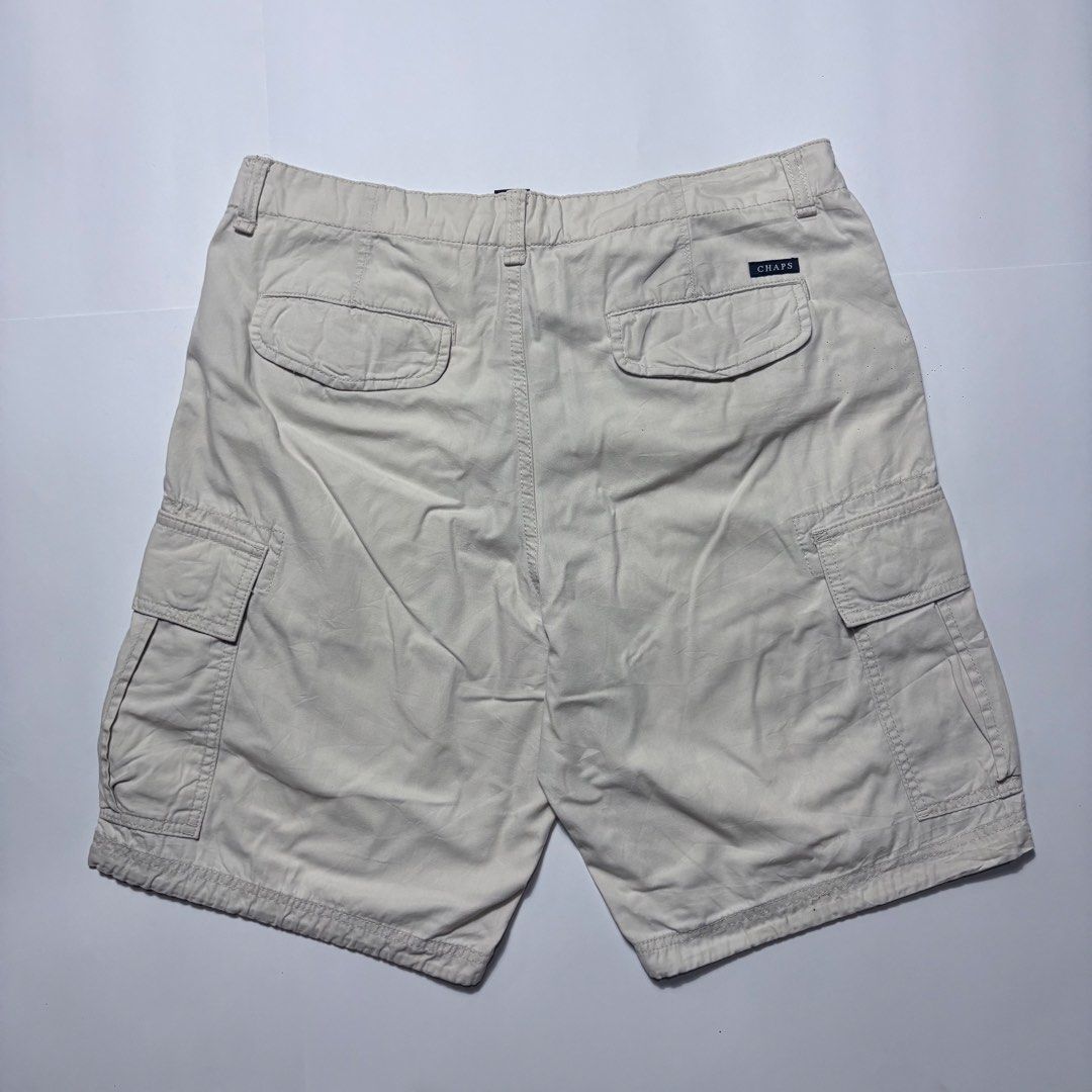 Chaps Cargo Shorts Beige Men's Size 33 (Category: Shorts) located in San Fernando. Submitted by lumang_gamit (Listing ID 1470397713, Image 2). Description: - Brand: Chaps - Color: Classic Beige - Size: 33 (Inner tag verified) - Material: Sturdy, durable cotton fabric - Pockets: Multiple utility pockets including buttoned back pockets and a secure zippered side pocket on the right leg - Closure: Front button closure with sturdy belt loops - Condit
