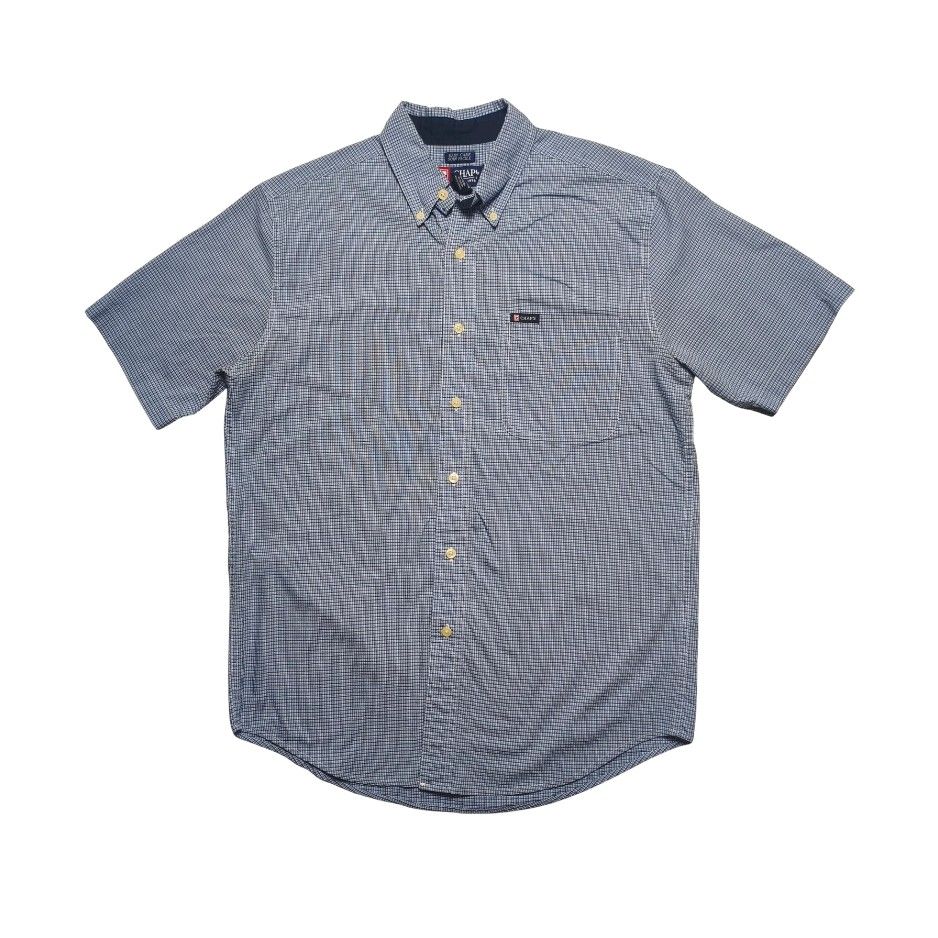 Chaps Men Blue Checkered Short Sleeve Button Down Shirt (Category: Tshirts & Polo Shirts ) located in Meycauayan. Submitted by thrifting_gorilla (Listing ID 1470528092, Image 1). Description: Chaps Men Blue Checkered Short Sleeve Button Down Shirt - Brand: Chaps - Style: Short sleeve button-down shirt - Pattern: Blue and white checkered - Material: Easy care 60% cotton, 40% polyester blend - Details: Classic button-down collar with accents, chest