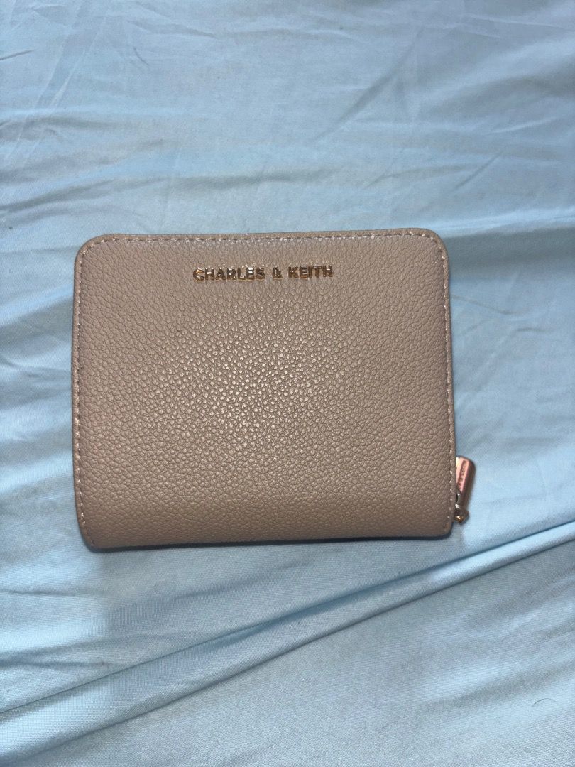 Charles & Keith Beige wallet (Category: Wallets & Card holders) located in Manila. Submitted by merr1031 (Listing ID 1470383505, Image 1). Description: This wallet is original. Bought from singapore trip, comes with the box. This is still negotiable :) : need funds .