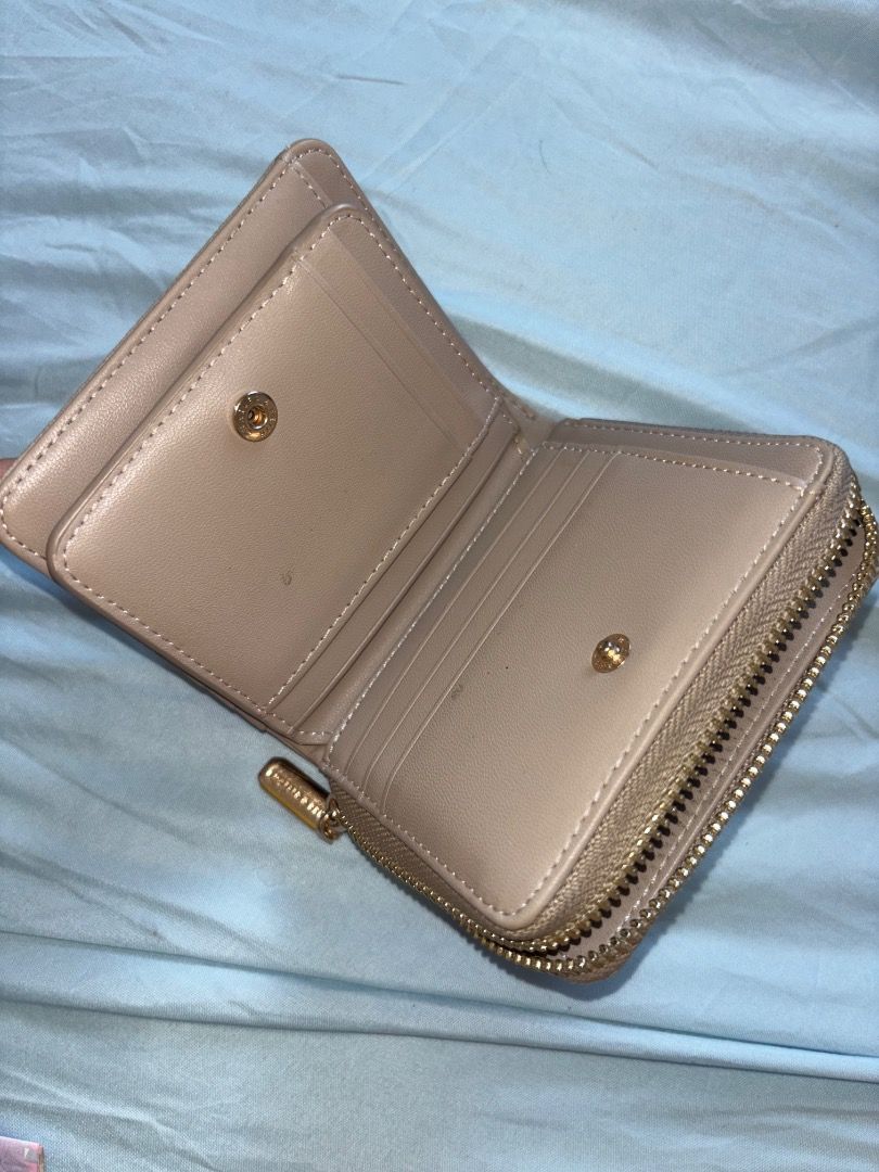 Charles & Keith Beige wallet (Category: Wallets & Card holders) located in Manila. Submitted by merr1031 (Listing ID 1470383505, Image 3). Description: This wallet is original. Bought from singapore trip, comes with the box. This is still negotiable :) : need funds .