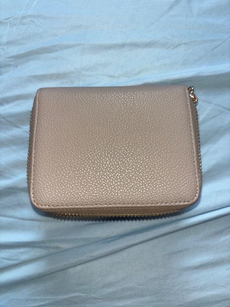 Charles & Keith Beige wallet (Category: Wallets & Card holders) located in Manila. Submitted by merr1031 (Listing ID 1470383505, Image 2). Description: This wallet is original. Bought from singapore trip, comes with the box. This is still negotiable :) : need funds .