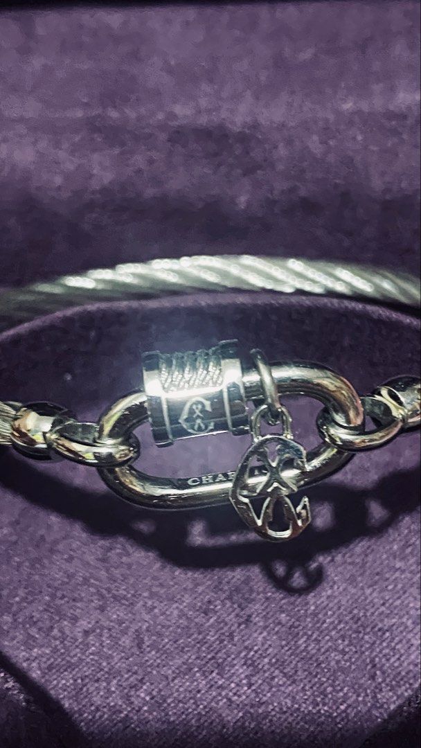 Charriol Geneve Cable Bracelet (Category: Bracelets) located in Quezon City. Submitted by maismaria (Listing ID 1470419932, Image 2). Description: - 100% Authentic Charriol Forever lock cable bangle - Silver-tone link closure with engraved logo barrel and hanging anchor charm - Includes original box - Size: Medium - Like New/Seldom used .