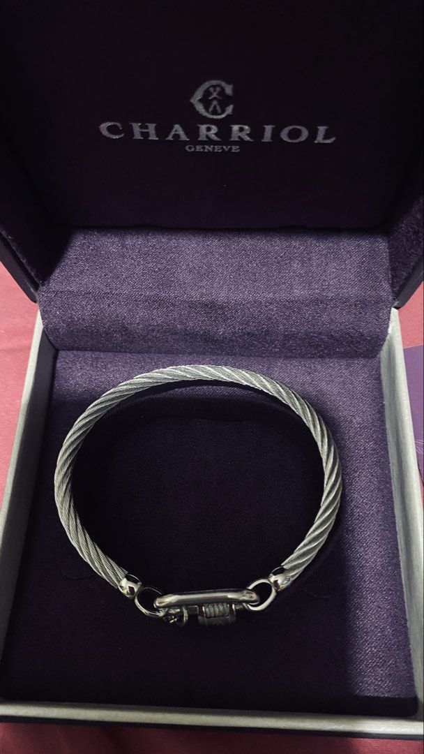 Charriol Geneve Cable Bracelet (Category: Bracelets) located in Quezon City. Submitted by maismaria (Listing ID 1470419932, Image 3). Description: - 100% Authentic Charriol Forever lock cable bangle - Silver-tone link closure with engraved logo barrel and hanging anchor charm - Includes original box - Size: Medium - Like New/Seldom used .