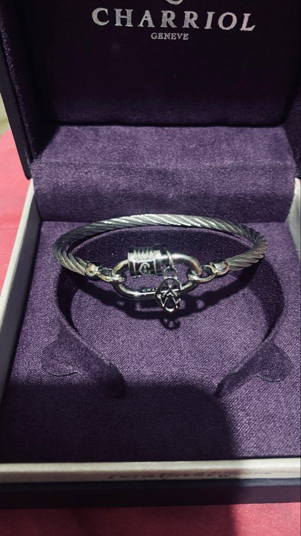 Charriol Geneve Cable Bracelet (Category: Bracelets) located in Quezon City. Submitted by maismaria (Listing ID 1470419932, Image 1). Description: - 100% Authentic Charriol Forever lock cable bangle - Silver-tone link closure with engraved logo barrel and hanging anchor charm - Includes original box - Size: Medium - Like New/Seldom used .
