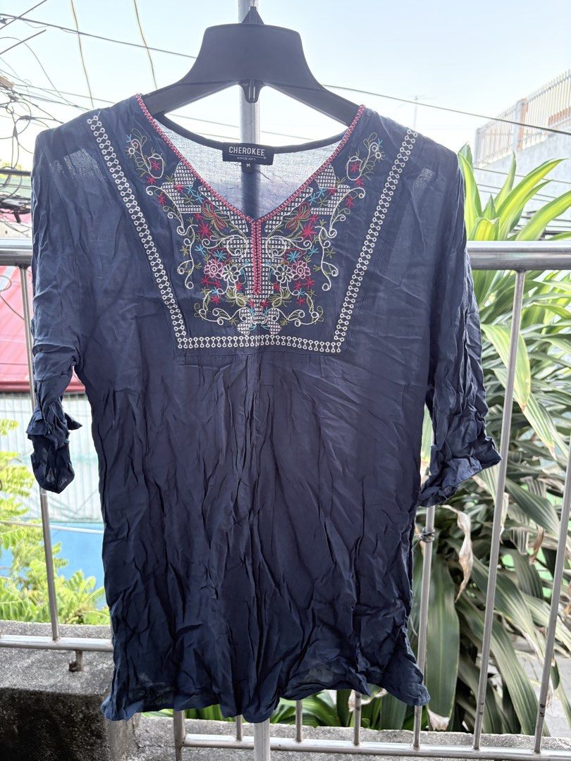 Cherokee Blue Embroidered V-Neck Blouse Size M (Category: Blouses) located in Cavite. Submitted by earthread (Listing ID 1470453058, Image 1). Description: - Brand: Cherokee - Size: Medium (M) - Color: Dark blue (solid back with gathered yoke) - Neckline: V-neck with vibrant, colorful embroidery around the chest - Sleeves: Three-quarter length with gathered cuffs - Fit: Relaxed fit in a lightweight, breathable fabric - Condition: Great everyday p