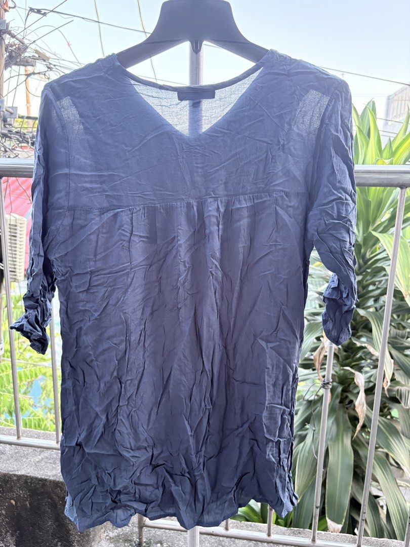 Cherokee Blue Embroidered V-Neck Blouse Size M (Category: Blouses) located in Cavite. Submitted by earthread (Listing ID 1470453058, Image 2). Description: - Brand: Cherokee - Size: Medium (M) - Color: Dark blue (solid back with gathered yoke) - Neckline: V-neck with vibrant, colorful embroidery around the chest - Sleeves: Three-quarter length with gathered cuffs - Fit: Relaxed fit in a lightweight, breathable fabric - Condition: Great everyday p