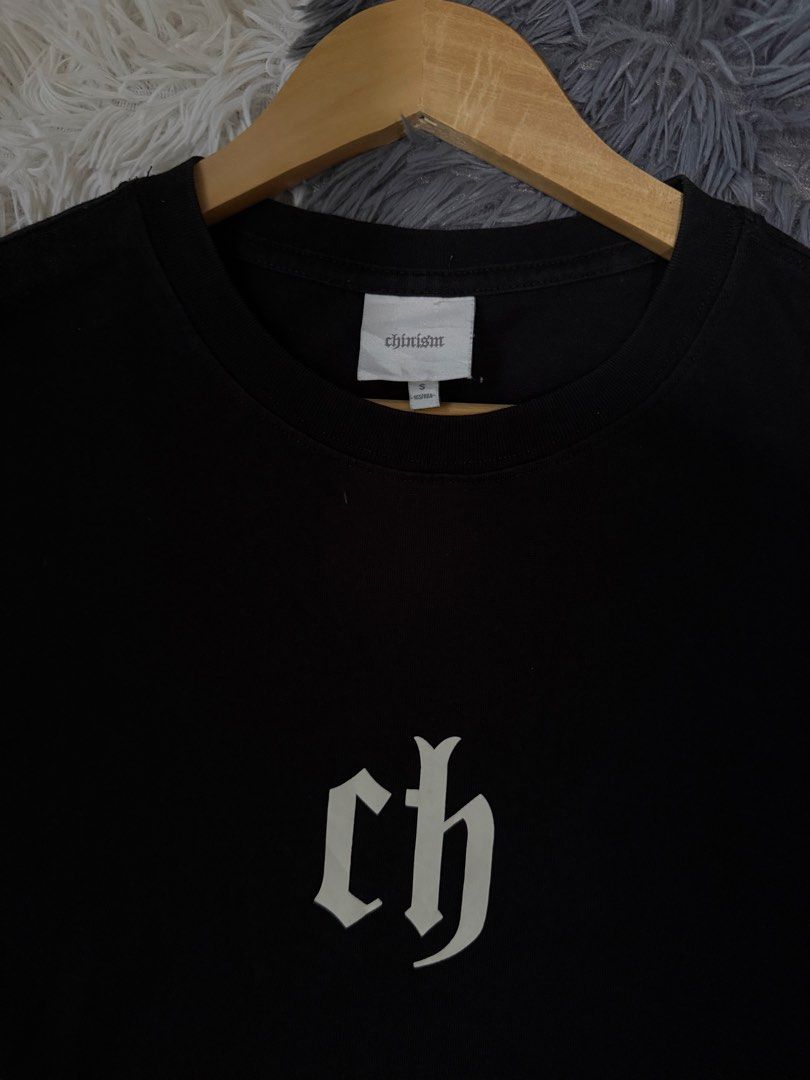 Chinistm Black Graphic Tee Size S (Category: Tshirts & Polo Shirts ) located in Manila. Submitted by keepercollection (Listing ID 1470376833, Image 2). Description: - Brand: Chinistm - Color: Black short sleeve t-shirt - Design: White gothic CH logo printed on the chest - Size: S (Marked 165/88A) - Measurements: ~22" pit to pit, ~29" total length - Material: Heavyweight cotton - Condition: Clean and ready to wear.