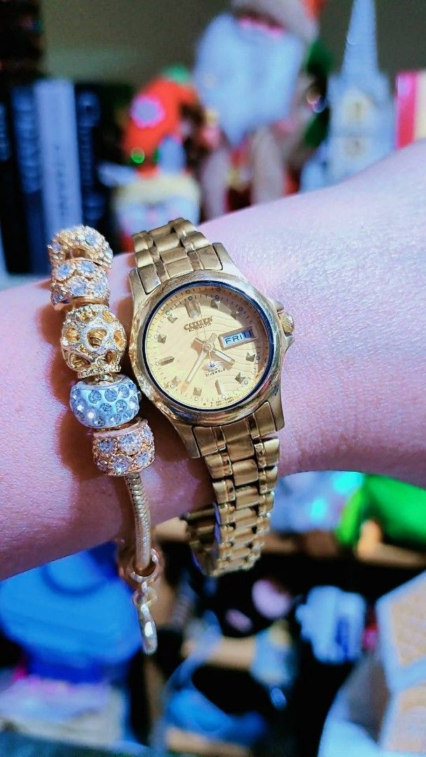 Citizen Automatic Gold-Tone Ladies Watch (Category: Women's Watches) located in Baliuag. Submitted by marieannfernando23 (Listing ID 1470368254, Image 2). Description: - Authentic vintage gold-tone Citizen automatic watch - Beautiful textured dial with a convenient day-date window at 3 o'clock - Reliable 21 jewels automatic movement - Secure metal link bracelet with clasp engraving - Versatile daily wear size that fits any occasion - Small face -
