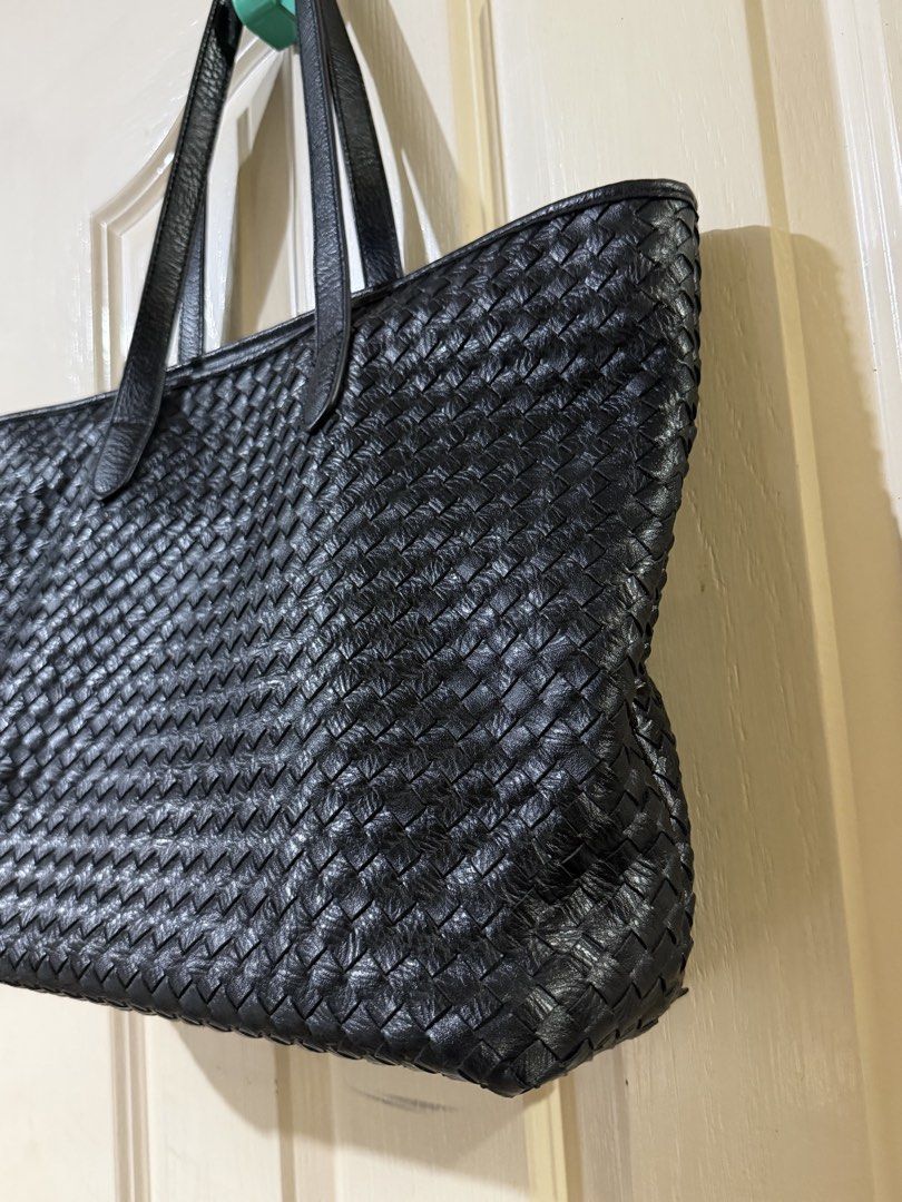 Classic Woven Leather Tote in Black (Category: Tote Bags) located in Pasig City. Submitted by paolasoriano_wind (Listing ID 1470451610, Image 3). Description: Lightly used. No damages except for some signs of use on handle (not easily noticeable / not an issue). Overall EXCELLENT CONDITION. Preloved but well taken-cared of. Faux leather. Does not look cheap. Size: Large (can fit a 13” MacBook and other items). With zipper and lining. Sturdy, spac