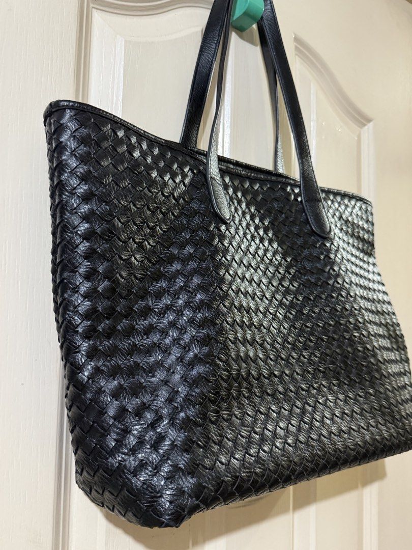 Classic Woven Leather Tote in Black (Category: Tote Bags) located in Pasig City. Submitted by paolasoriano_wind (Listing ID 1470451610, Image 2). Description: Lightly used. No damages except for some signs of use on handle (not easily noticeable / not an issue). Overall EXCELLENT CONDITION. Preloved but well taken-cared of. Faux leather. Does not look cheap. Size: Large (can fit a 13” MacBook and other items). With zipper and lining. Sturdy, spac