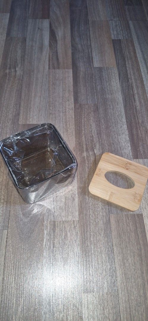 Clear and Wooden Tissue Box Holder (Category: Storage Boxes & Baskets) located in San Juan City. Submitted by mamba_collectibles (Listing ID 1470554085, Image 3). Description: - Modern & Minimalist: Clear plastic body with a stylish bamboo wooden top lid that fits any tabletop or desk. - Easy Refilling: Removable wooden lid allows for quick and simple tissue refills. - Perfect Fit: Designed to hold standard tissue sizes securely. - Versatile Use: