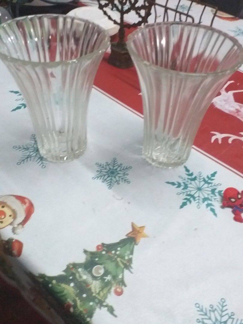 Clear Glass Fluted Flower Vases Set (Category: Vases & Decorative Bowls) located in Manila. Submitted by wisegem-231b (Listing ID 1470398808, Image 2). Description: - Set of 2 matching clear glass vases - Elegant fluted vertical ribbing with a flared top rim - Sturdy flat bases for stability - Versatile clear glass complements any flowers or room decor - Clean inside and out, ready for use.