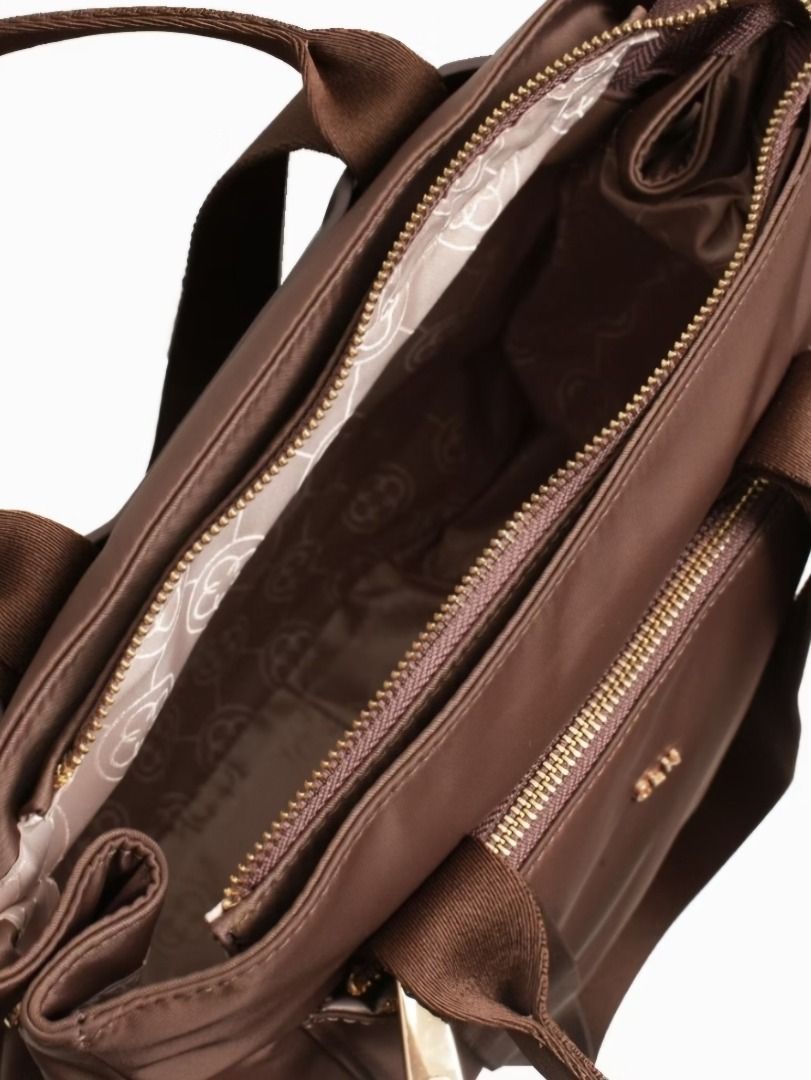 CLN 0825H-Primo Convertible Nylon Backpack Handbag (Category: Backpacks) located in Caloocan City. Submitted by superayee (Listing ID 1470400389, Image 3). Description: - 100% Authentic CLN brand - Color: Classic brown nylon with fabric lining - 2-in-1 Design: Easily converts from a shoulder bag to a backpack - Storage: Zip-top closure, 2 exterior zipper pockets, 2 exterior magnetic snap pockets, and 1 interior slip pocket - Tech-friendly: Padded