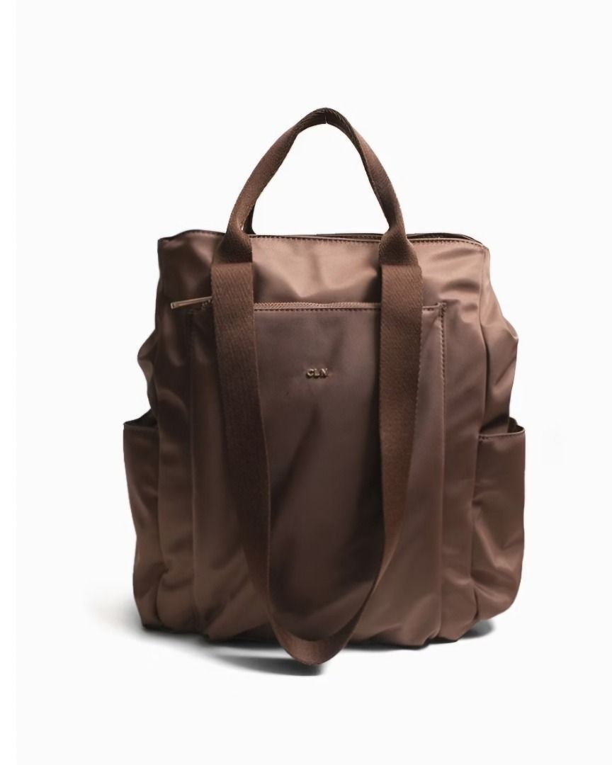 CLN 0825H-Primo Convertible Nylon Backpack Handbag (Category: Backpacks) located in Caloocan City. Submitted by superayee (Listing ID 1470400389, Image 1). Description: - 100% Authentic CLN brand - Color: Classic brown nylon with fabric lining - 2-in-1 Design: Easily converts from a shoulder bag to a backpack - Storage: Zip-top closure, 2 exterior zipper pockets, 2 exterior magnetic snap pockets, and 1 interior slip pocket - Tech-friendly: Padded