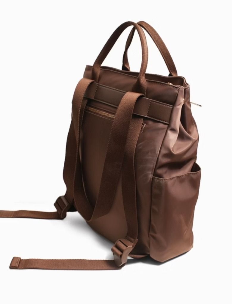 CLN 0825H-Primo Convertible Nylon Backpack Handbag (Category: Backpacks) located in Caloocan City. Submitted by superayee (Listing ID 1470400389, Image 2). Description: - 100% Authentic CLN brand - Color: Classic brown nylon with fabric lining - 2-in-1 Design: Easily converts from a shoulder bag to a backpack - Storage: Zip-top closure, 2 exterior zipper pockets, 2 exterior magnetic snap pockets, and 1 interior slip pocket - Tech-friendly: Padded