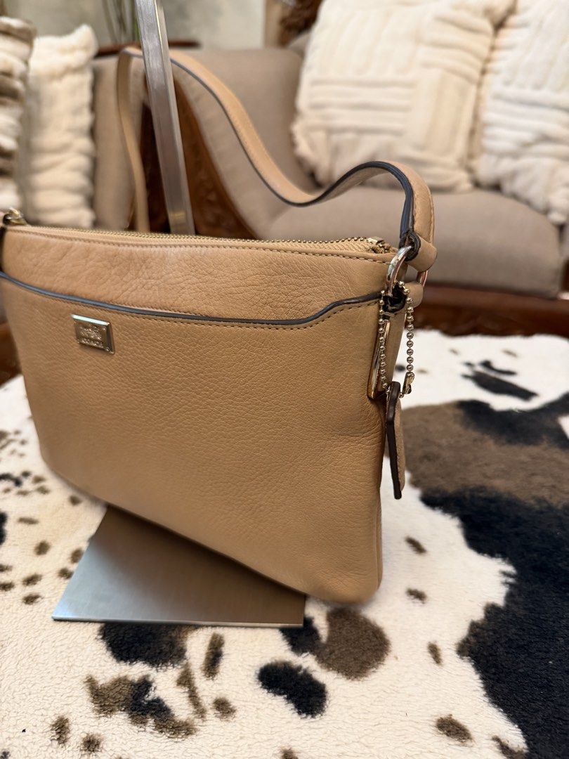 Coach Beige Leather Crossbody Bag (Category: Cross-body Bags) located in Santiago. Submitted by yrellagnoihsaf (Listing ID 1470380753, Image 2). Description: Orig Coach sling bag genuine leather walang ganong ganap sa buhay normal signs of wear onlee konting dirt fading rubber lining intact no peeling kasya long wallet at promax onting anik 💋💋💋.
