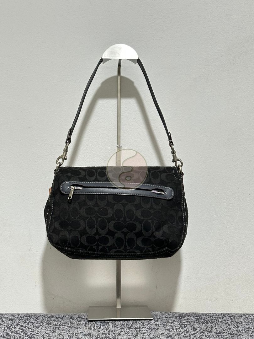 Coach Black Canvas Soft Tabby Shoulder (Category: Luxury Bags & Wallets) located in Mandaluyong City. Submitted by adoresellie (Listing ID 1470428570, Image 2). Description: 2022 Coach Black Canvas Soft Tabby Shoulder CG094 Made in Vietnam Preloved bag with FLAWS (check photos): - No long sling - Not for resellers - Bawal sa maselan RFS: Decluttering Disclaimer: Not affiliated with or endorsed by any brand. I am simply selling my personal pre-own