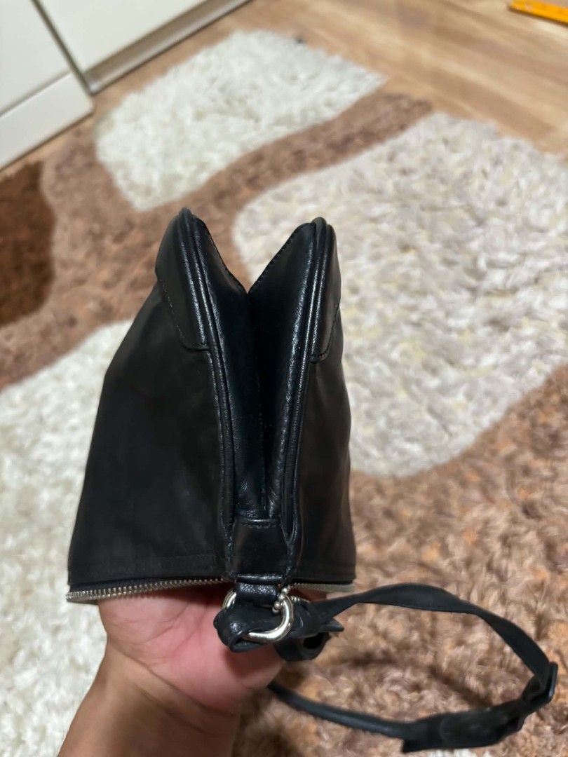Coach Black Leather Shoulder Bag (Category: Luxury Bags & Wallets) located in Daet. Submitted by jemotovlog28 (Listing ID 1470399013, Image 3). Description: - Brand: Coach - Material: Genuine black leather - Style: Slim silhouette shoulder bag with single strap - Closure: Secure top zipper - Details: Includes iconic metal Coach hangtag - Interior: Fabric-lined with official leather creed patch and serial number (J1K-8324) - Fit: Compact and light
