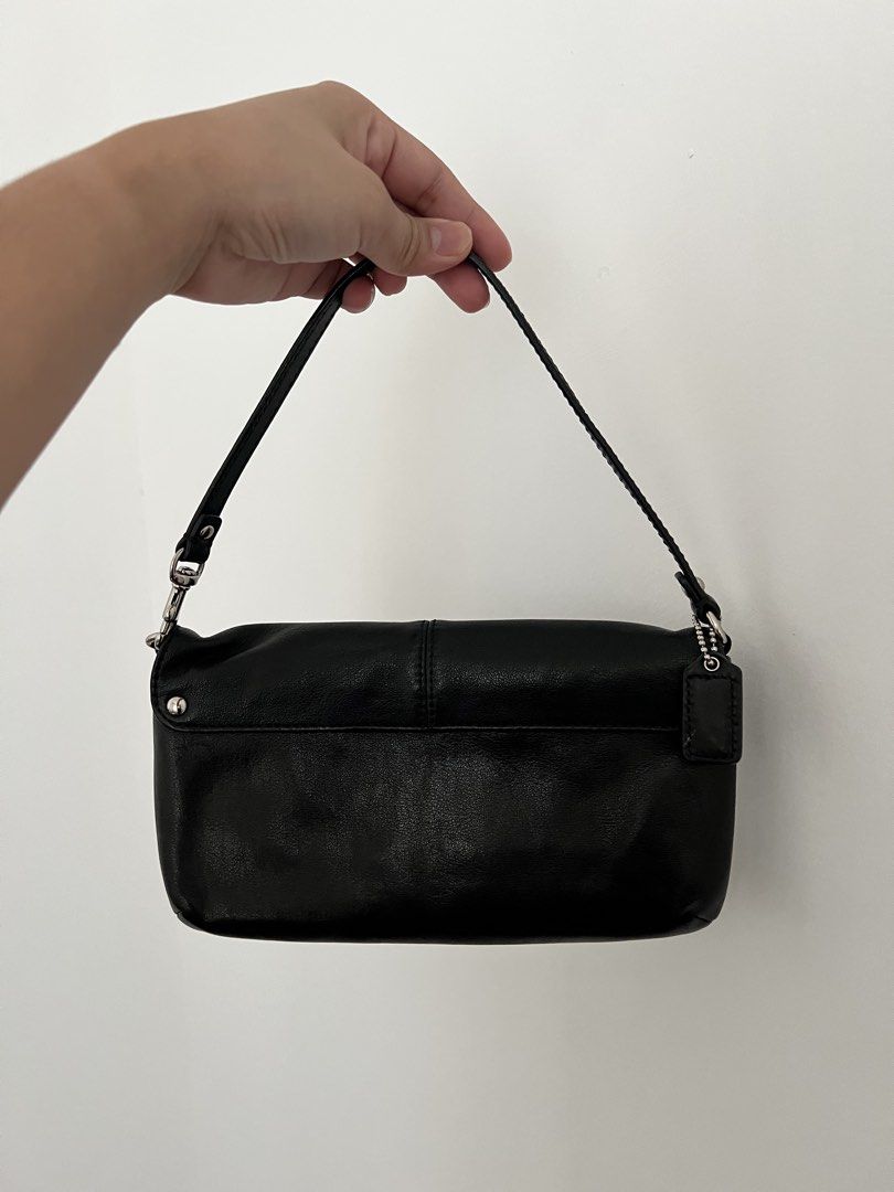 Coach Black Leather Shoulder Bag (Category: Luxury Bags & Wallets) located in Makati City. Submitted by lovedbyliv_ (Listing ID 1470466777, Image 3). Description: - Brand: Coach - Color: Classic Black Leather - Hardware: Silver-tone - Closure: Secure top zip - Design: Pleated front with Coach script logo - Interior: Black fabric lining with built-in card slots - Extras: Detachable strap and original leather hangtag included - Condition: Excellent