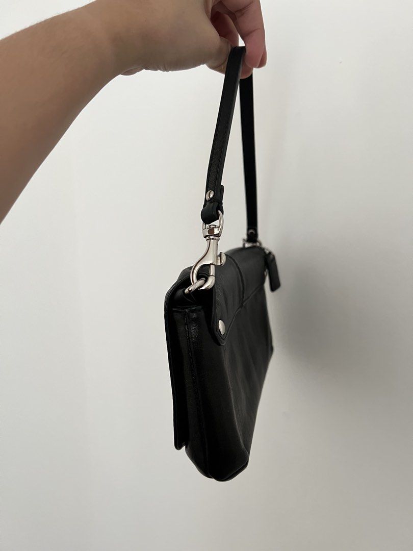 Coach Black Leather Shoulder Bag (Category: Luxury Bags & Wallets) located in Makati City. Submitted by lovedbyliv_ (Listing ID 1470466777, Image 2). Description: - Brand: Coach - Color: Classic Black Leather - Hardware: Silver-tone - Closure: Secure top zip - Design: Pleated front with Coach script logo - Interior: Black fabric lining with built-in card slots - Extras: Detachable strap and original leather hangtag included - Condition: Excellent