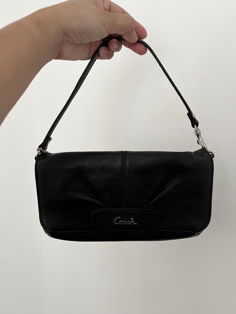 Coach Black Leather Shoulder Bag (Category: Luxury Bags & Wallets) located in Makati City. Submitted by lovedbyliv_ (Listing ID 1470466777, Image 1). Description: - Brand: Coach - Color: Classic Black Leather - Hardware: Silver-tone - Closure: Secure top zip - Design: Pleated front with Coach script logo - Interior: Black fabric lining with built-in card slots - Extras: Detachable strap and original leather hangtag included - Condition: Excellent