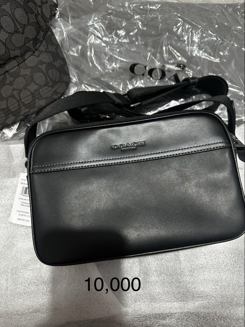 Coach Graham Crossbody Bag Black (Category: Cross-body Bags) located in Cabanatuan. Submitted by paul04_moon (Listing ID 1470397813, Image 3). Description: - Authentic Coach Graham crossbody bag in classic black leather - Sleek design featuring dual zipped compartments - Comfortable adjustable strap for easy wear - Subtle debossed Coach logo on the front - Includes original tag with retail price - Perfect everyday carryall for your daily essentia
