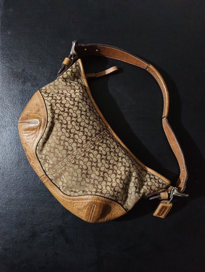 Coach Hobo Bag (Category: Luxury Bags & Wallets) located in Manila. Submitted by fgkamiseta_2nd (Listing ID 1470460539, Image 1). Description: - Authentic Coach Hobo Bag signature C canvas shoulder bag with rich brown leather trim - Adjustable shoulder strap featuring stylish silver-tone hardware and buckle closure - Secure zip-top closure to keep your essentials safe - Structured bottom corners with contrast stitching for added durability - Come
