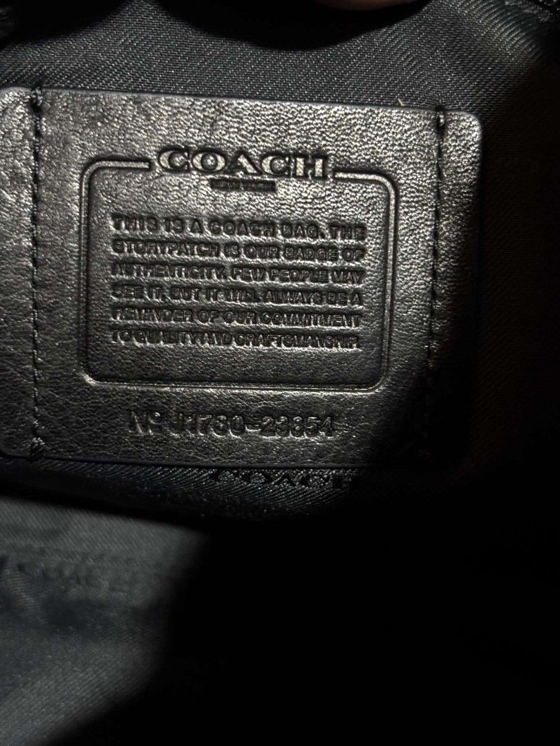 Coach Leather Briefcase Messenger Bag Blue Black (Category: Briefcases) located in Daet. Submitted by jemotovlog28 (Listing ID 1470397875, Image 2). Description: - Authentic Coach pebbled leather briefcase in dark navy blue - Dual top carry handles and adjustable webbed shoulder strap - Flap closure with stylish textured black leather trim - Interior features official Coach storypatch with authentic stamped serial number - Durable solid construct