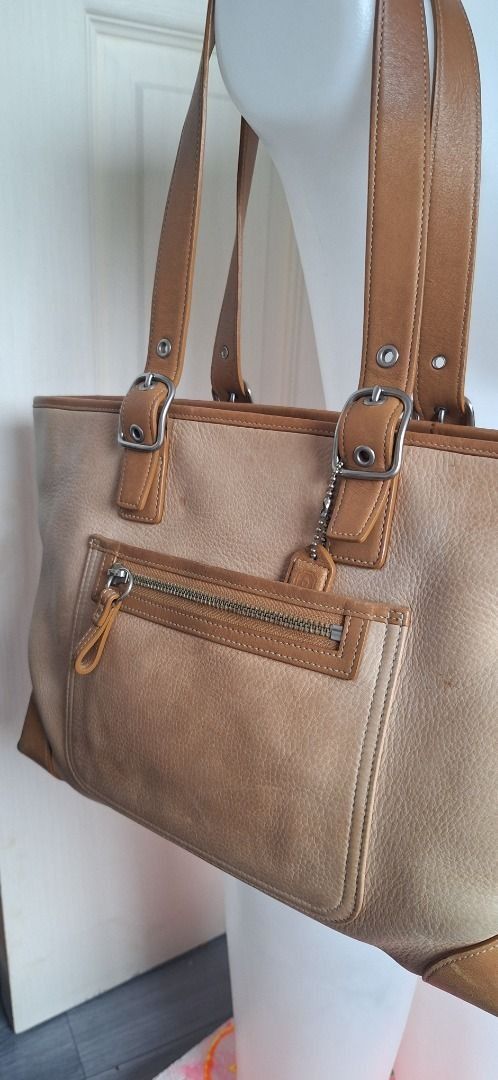 COACH Leather Brown Bag (Category: Luxury Bags & Wallets) located in General Trias. Submitted by aeunice (Listing ID 1470480156, Image 2). Description: Brand: Coach In Good condition. This Coach shoulder bag is made of soft leather in a classic light brown color. It’s perfect for everyday use and can easily match both casual and dressy outfits. The design is simple, stylish and built to last. Meet up or Shipping via Lalamove, JnT, Gogo Express & 
