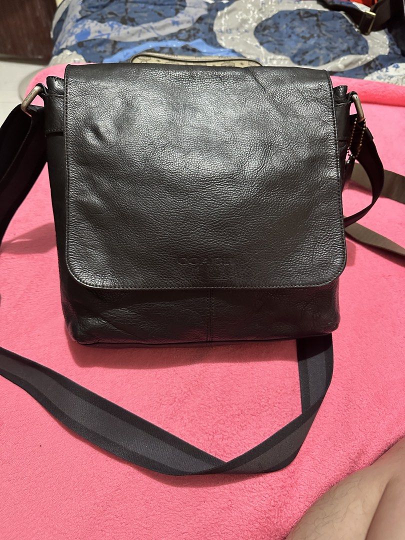 Coach Leather Messenger Crossbody Bag (Category: Luxury Bags & Wallets) located in Quezon City. Submitted by pongoy (Listing ID 1470392117, Image 1). Description: - Authentic Coach messenger bag in classic black - Crafted from genuine pebble leather with fabric lining - Secure flap closure featuring a subtle debossed logo - Adjustable fabric strap for comfortable shoulder or crossbody wear - Convenient exterior zip pocket located right under the 