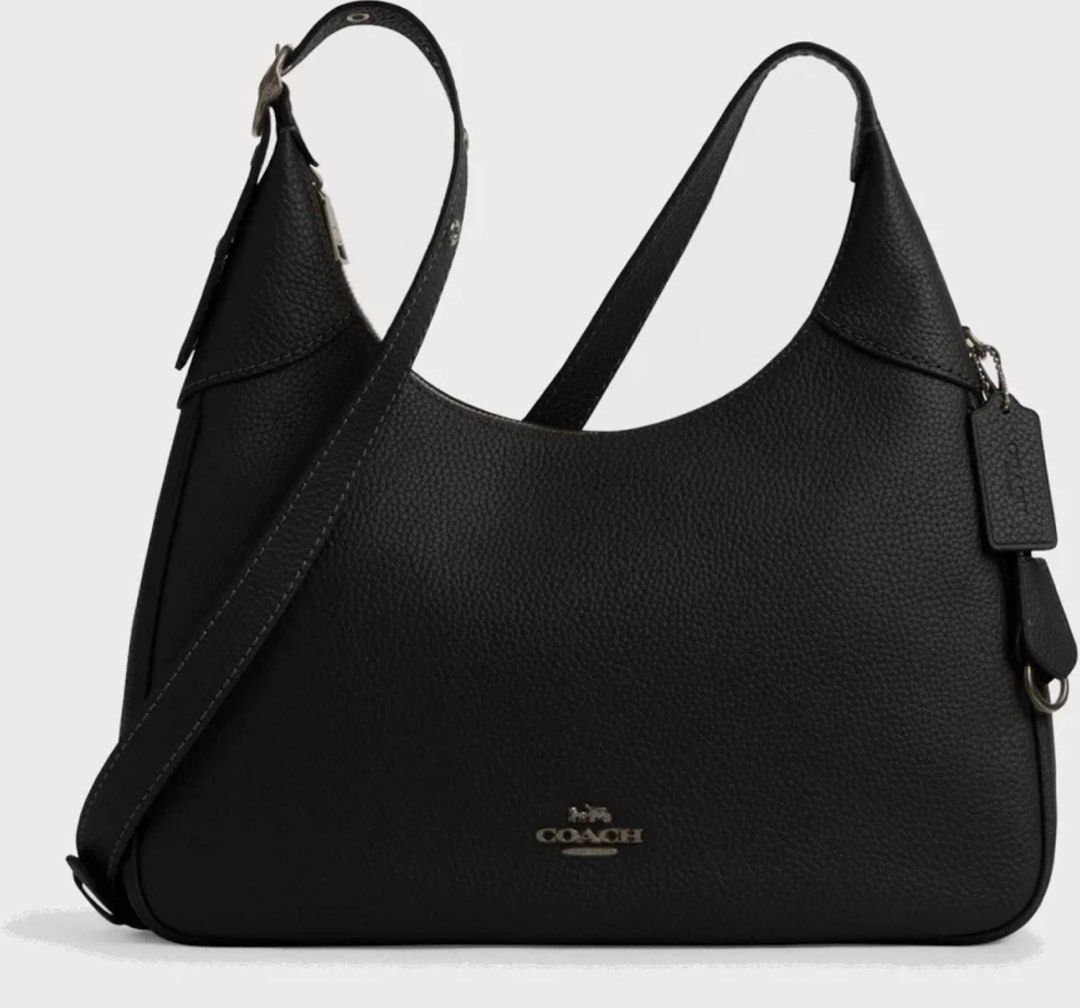 Coach Lux Pebble Ella Shoulder Bag Black (Category: Luxury Bags & Wallets) located in Cabanatuan. Submitted by paul04_moon (Listing ID 1470395978, Image 1). Description: - Authentic Coach Lux Pebble Ella shoulder bag in classic black leather - Secure zip top closure with a spacious interior that fits a wallet, phone, and water bottle - Adjustable strap featuring stylish silver-tone hardware and buckle detail - Perfect everyday luxury bag for work