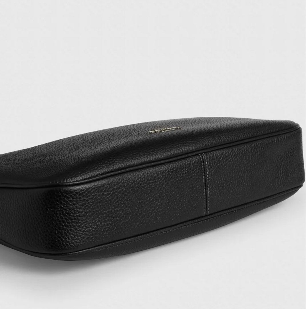 Coach Lux Pebble Ella Shoulder Bag Black (Category: Luxury Bags & Wallets) located in Cabanatuan. Submitted by paul04_moon (Listing ID 1470395978, Image 2). Description: - Authentic Coach Lux Pebble Ella shoulder bag in classic black leather - Secure zip top closure with a spacious interior that fits a wallet, phone, and water bottle - Adjustable strap featuring stylish silver-tone hardware and buckle detail - Perfect everyday luxury bag for work
