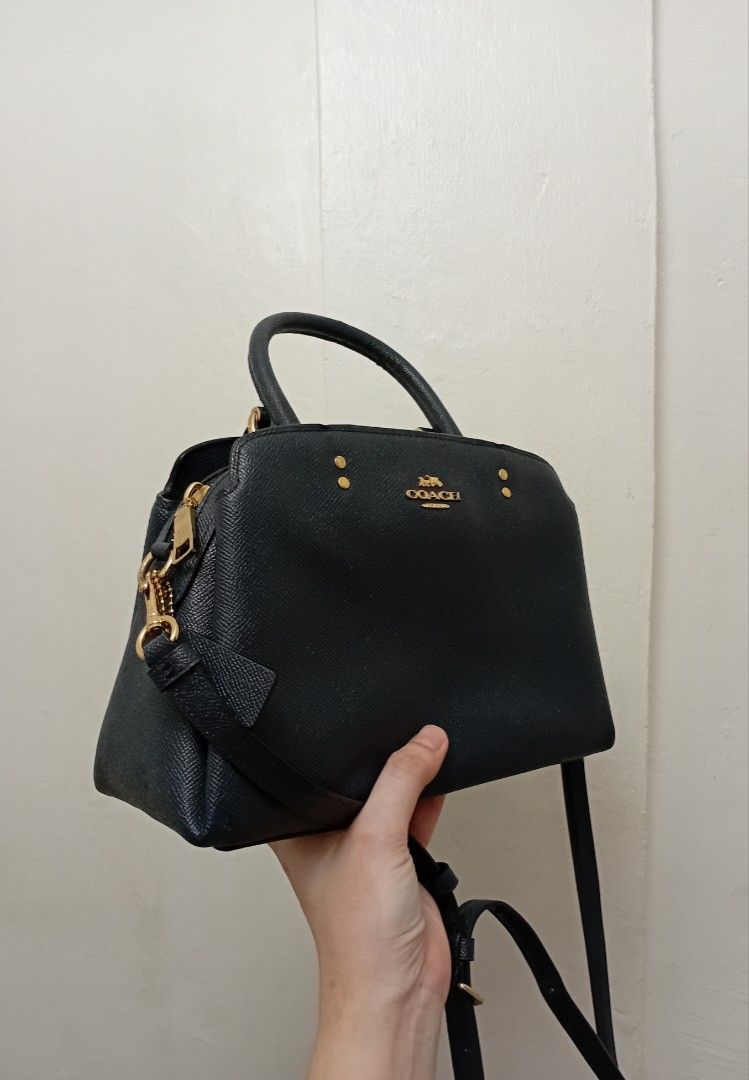 Coach Mini .lLilie CaryAll (Category: Luxury Bags & Wallets) located in Navotas City. Submitted by ms.soulana (Listing ID 1470466887, Image 2). Description: PreOwned likeNew Llightly Used Authentic Coach Mini lilie CaryAll Handbag ,Crossbody - Color:Navy Blue - Material: Textured Saffiano leather with gold-tone hardware - Closure: Secure top zipper - Carry Options: Dual grab handles and adjustable/removable crossbody strap - Includes: Matching le