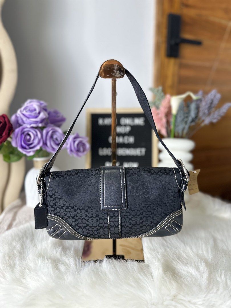 Coach Mini Soho Signature Baguette (Category: Shoulder Bags) located in Sablan. Submitted by kayescorner (Listing ID 1470354815, Image 2). Description: Coach Mini Soho Signature Baguette Shoulder Bag GOOD PRE-OWNED CONDITION / RANK AB 📌Signs of wear minor corner rubbing, visible scratches on hardware, soft leather handle w/ crack lining 📌Overall, the bag remains presentable and suitable for everyday use. 💰8,350.00 BENGUET AREA 📍 Shipping: J&T