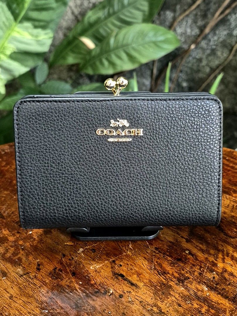 Coach Pebbled Leather Bi-fold Kisslock Wallet (Category: Wallets & Card holders) located in Quezon City. Submitted by gbabesy (Listing ID 1470357110, Image 1). Description: Seasonal decluttering ✨️ Letting go of extra wallets bought from my Japan trip in March 2026 Like new condition, very hard to let go 💔 Black and white tag present Made in Cambodia.
