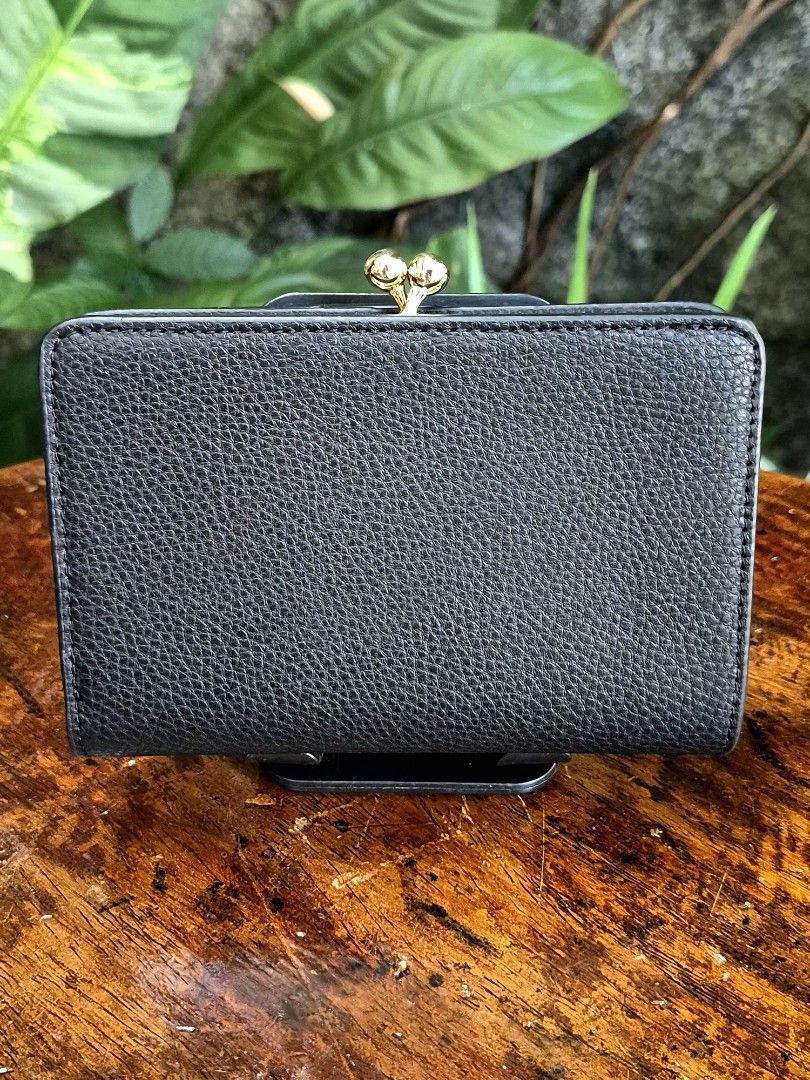 Coach Pebbled Leather Bi-fold Kisslock Wallet (Category: Wallets & Card holders) located in Quezon City. Submitted by gbabesy (Listing ID 1470357110, Image 2). Description: Seasonal decluttering ✨️ Letting go of extra wallets bought from my Japan trip in March 2026 Like new condition, very hard to let go 💔 Black and white tag present Made in Cambodia.