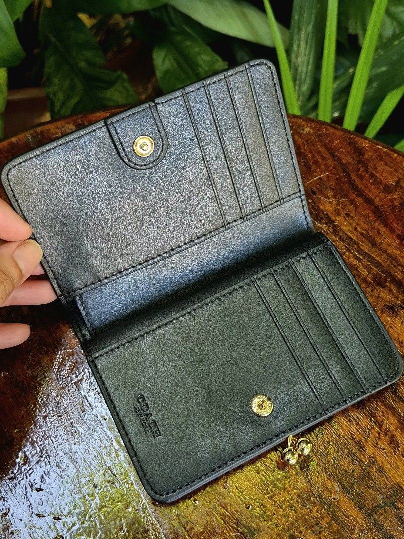 Coach Pebbled Leather Bi-fold Kisslock Wallet (Category: Wallets & Card holders) located in Quezon City. Submitted by gbabesy (Listing ID 1470357110, Image 3). Description: Seasonal decluttering ✨️ Letting go of extra wallets bought from my Japan trip in March 2026 Like new condition, very hard to let go 💔 Black and white tag present Made in Cambodia.