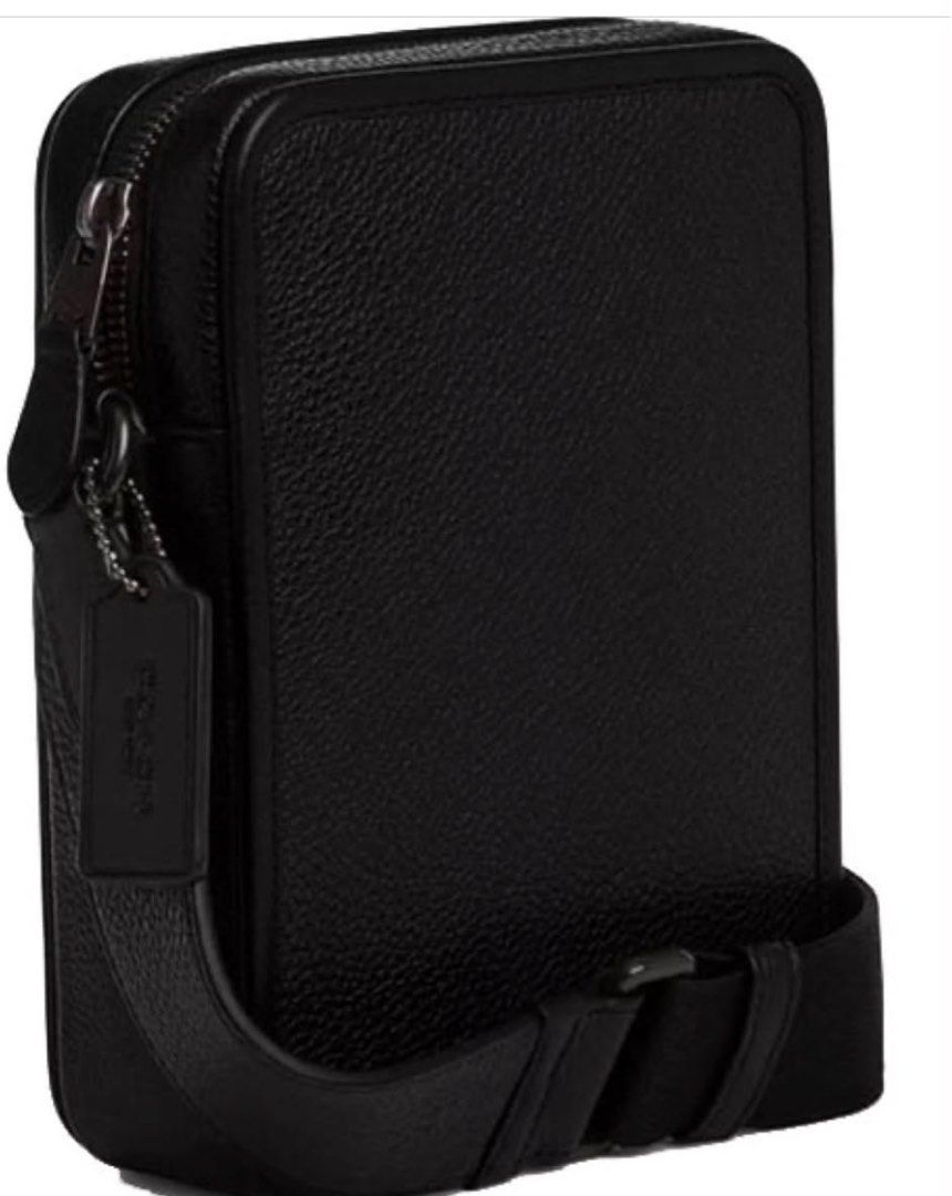 Coach Pebbled Leather Black Crossbody Bag (Category: Cross-body Bags) located in Cabanatuan. Submitted by paul04_moon (Listing ID 1470398009, Image 2). Description: - Brand new, never used and still in original packaging with protective foam - Authentic Coach black crossbody bag made of premium pebbled leather - Secure top zipper closure with convenient exterior slip pocket - Comes with an adjustable strap and matching hangtag - Perfect condition