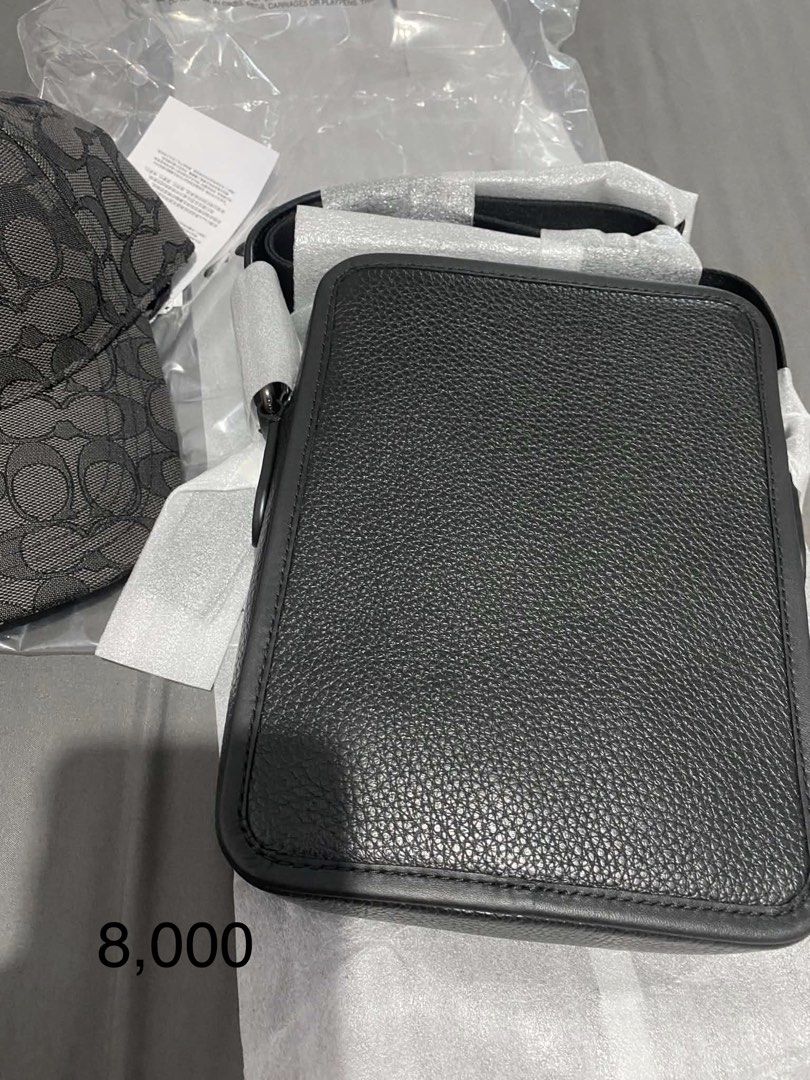 Coach Pebbled Leather Black Crossbody Bag (Category: Cross-body Bags) located in Cabanatuan. Submitted by paul04_moon (Listing ID 1470398009, Image 3). Description: - Brand new, never used and still in original packaging with protective foam - Authentic Coach black crossbody bag made of premium pebbled leather - Secure top zipper closure with convenient exterior slip pocket - Comes with an adjustable strap and matching hangtag - Perfect condition