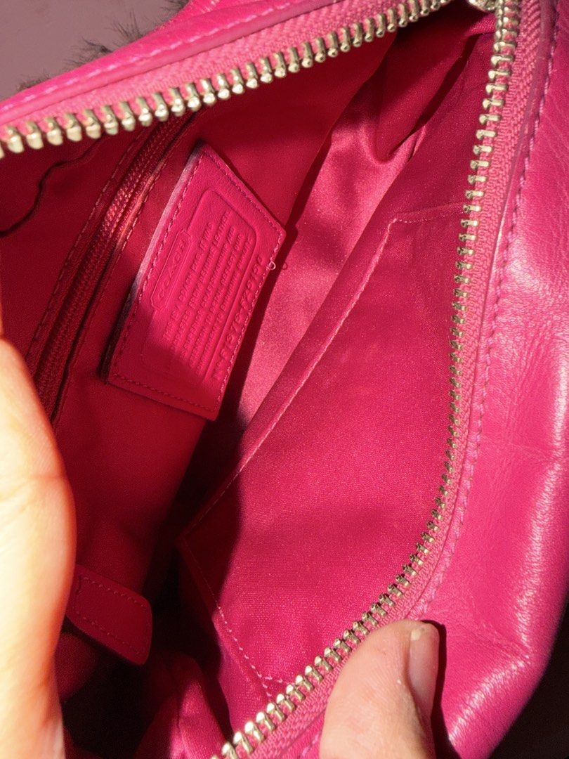 Coach Pink Leather Crossbody Bag (Category: Luxury Bags & Wallets) located in Quezon City. Submitted by parischanelcollection (Listing ID 1470556569, Image 3). Description: - Authentic Coach leather crossbody bag in a vibrant bright pink color - Shiny silver-tone hardware with front flap pocket and secure buckle closure - Top zip closure opening to a clean pink fabric-lined interior - Includes one interior zip pocket and one slip pocket for organ