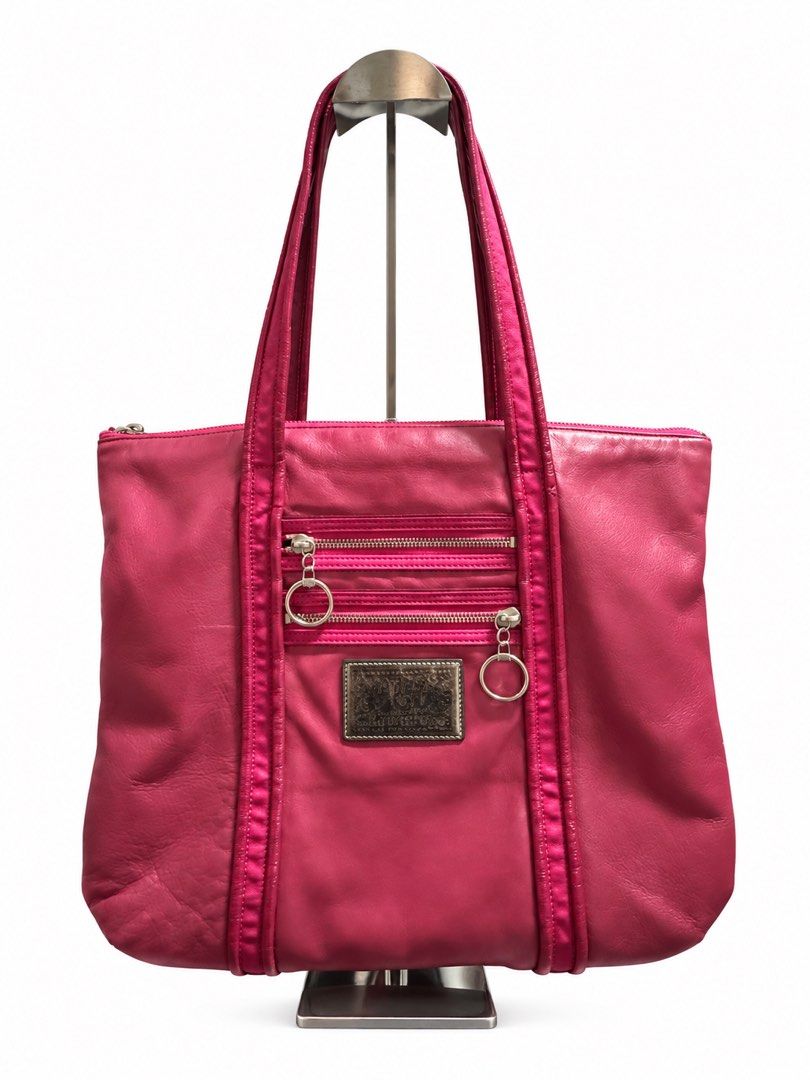 Coach Pink Leather Tote Bag (Category: Luxury Bags & Wallets) located in Tangub. Submitted by laurbepena33002 (Listing ID 1470354599, Image 1). Description: - Authentic Coach leather shoulder bag in a bold mettalic bright pink - Secure top zipper closure with 2 exterior zipped pockets and ring pulls - Vibrant purple satin interior lining with multiple slip pockets and a zip pocket - Shiny silver hardware details and metallic Coach creed patch - R