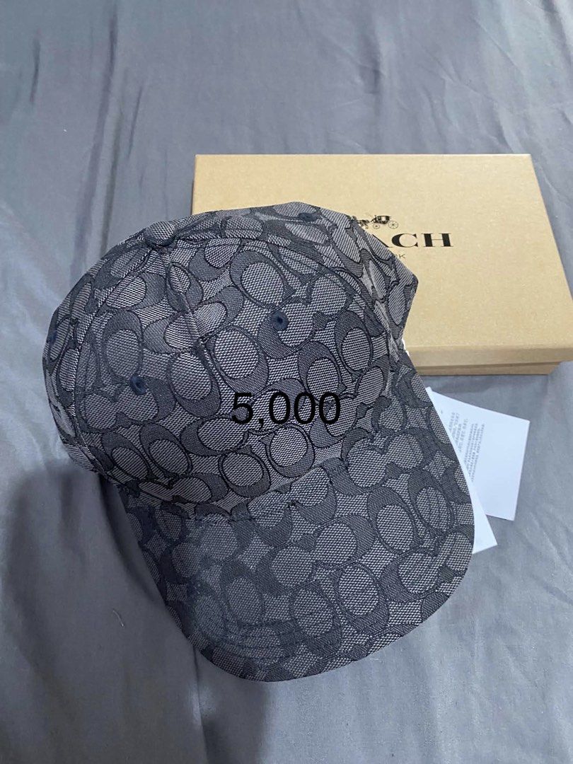 Coach Signature C Jacquard Baseball Cap (Category: Caps & Hats) located in Cabanatuan. Submitted by paul04_moon (Listing ID 1470398421, Image 1). Description: - Authentic Coach signature C pattern cap in dark grey and black - Brand new, never worn with clean structured brim - Adjustable back strap for a custom fit - Perfect for gifting or daily wear.