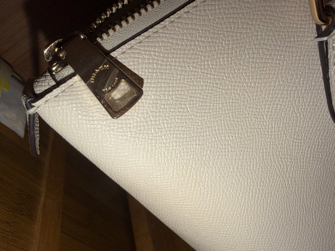 Coach Tote bag (Category: Tote Bags) located in Davao. Submitted by iceangel09 (Listing ID 1470389688, Image 3). Description: Crossgrain leather Inside cell phone and multifunction pockets Zip-top closure, fabric lining Handles with 10” drop 11 1/2” (L) x 9 1/2” (H) x 4 1/2” (W) Style No. 4454 Color: Chalk.