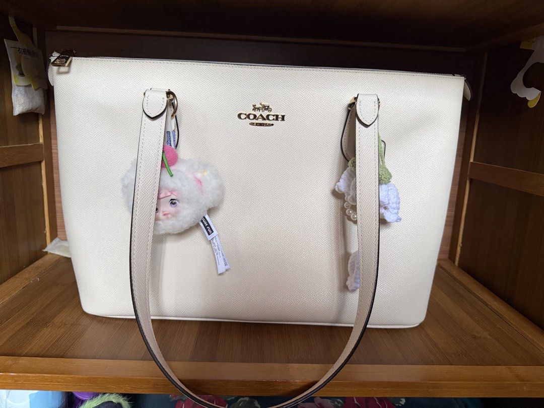 Coach Tote bag (Category: Tote Bags) located in Davao. Submitted by iceangel09 (Listing ID 1470389688, Image 1). Description: Crossgrain leather Inside cell phone and multifunction pockets Zip-top closure, fabric lining Handles with 10” drop 11 1/2” (L) x 9 1/2” (H) x 4 1/2” (W) Style No. 4454 Color: Chalk.
