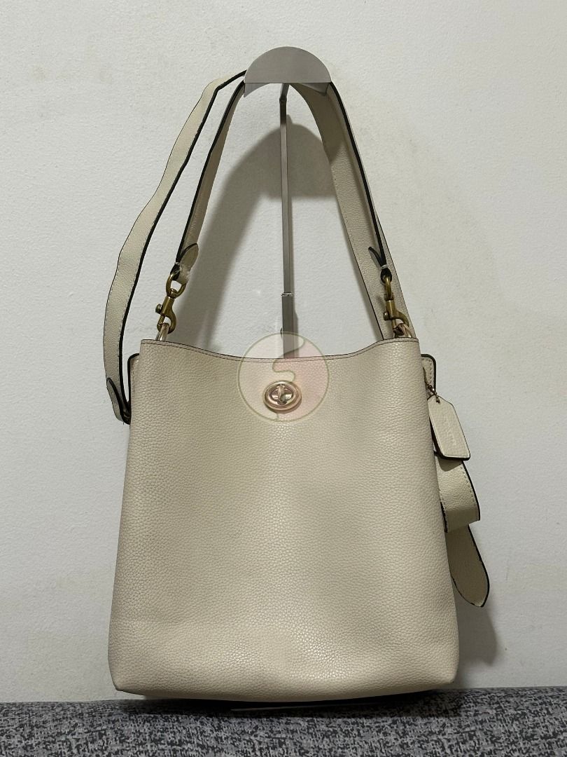 Coach White Leather Charlie Bucket (Category: Luxury Bags & Wallets) located in Mandaluyong City. Submitted by adoresellie (Listing ID 1470439125, Image 1). Description: 2019 Coach White Leather Charlie Bucket 55200 Made in Vietnam Preloved bag with FLAWS (check photos): - Small blue stains in body - Stains inside body - Replaced slings, but still Coach - Heavy - Not for resellers - Bawal sa maselan RFS: Decluttering Disclaimer: Not affiliated wi