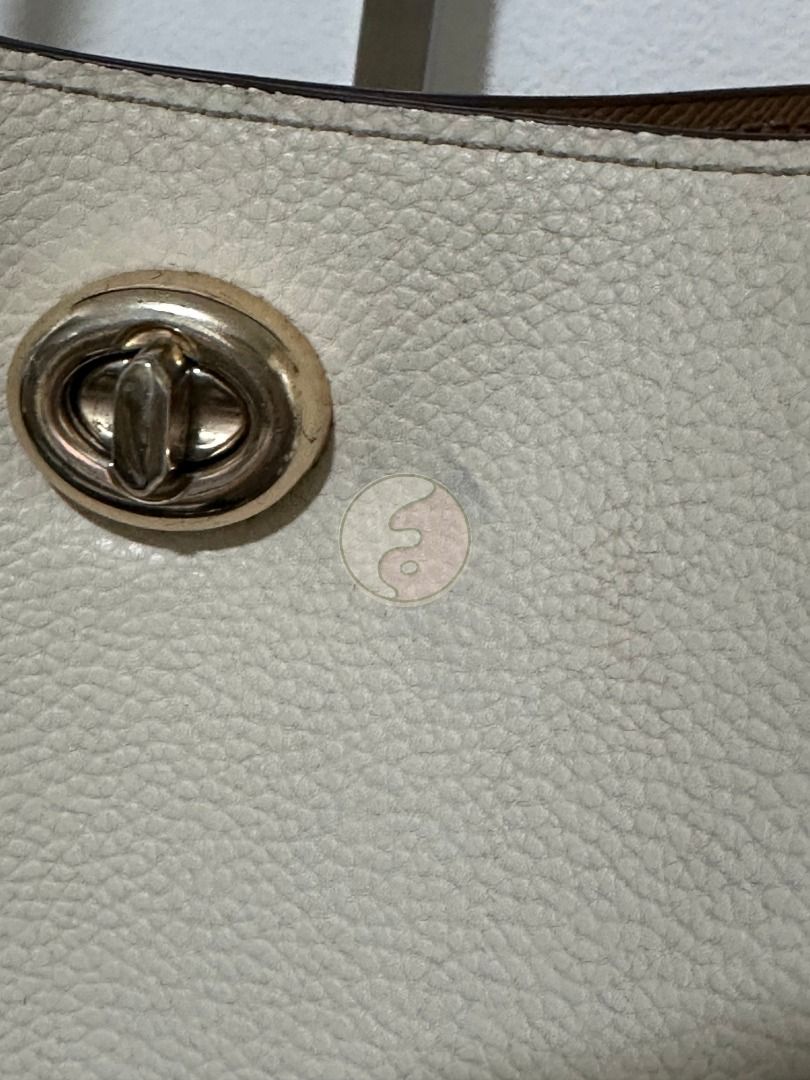 Coach White Leather Charlie Bucket (Category: Luxury Bags & Wallets) located in Mandaluyong City. Submitted by adoresellie (Listing ID 1470439125, Image 2). Description: 2019 Coach White Leather Charlie Bucket 55200 Made in Vietnam Preloved bag with FLAWS (check photos): - Small blue stains in body - Stains inside body - Replaced slings, but still Coach - Heavy - Not for resellers - Bawal sa maselan RFS: Decluttering Disclaimer: Not affiliated wi