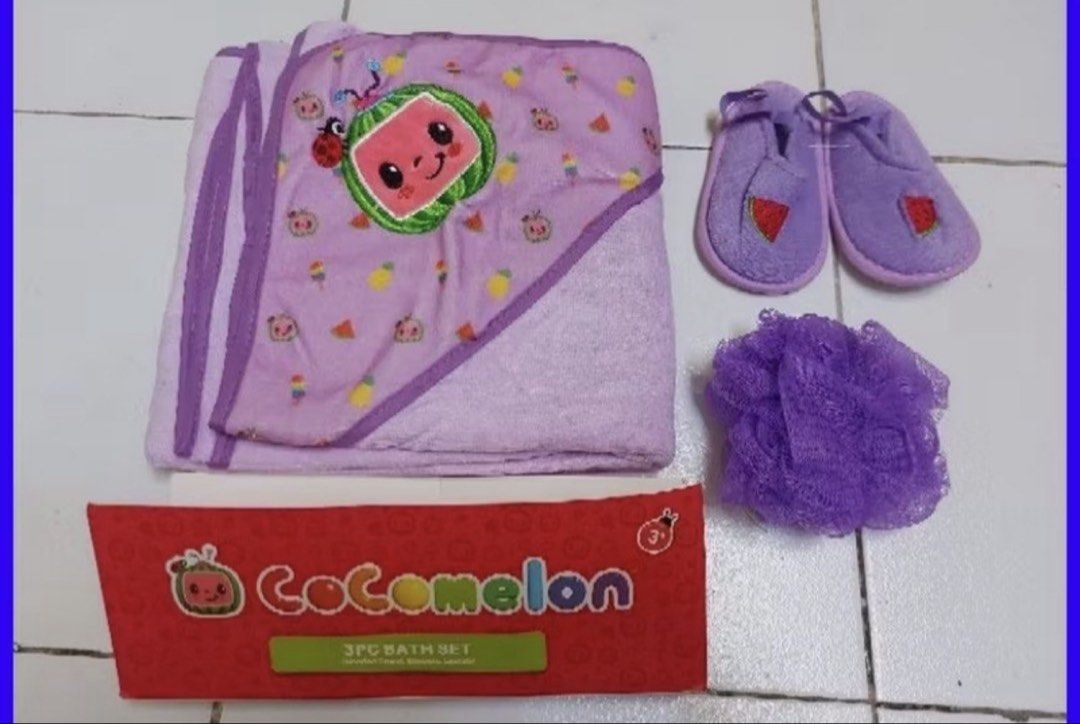 CoComelon 3PC Bath Set Towel Slippers Loofah (Category: Bathtub & Bath Accessories) located in Caloocan City. Submitted by aizabalan52674 (Listing ID 1470411447, Image 1). Description: - 100% Original CoComelon merchandise - 3-piece toddler bath set in a cute purple theme - Includes a cozy hooded towel with watermelon character graphic - Matching purple booties with adorable watermelon print - Soft purple bath sponge for gentle cleaning - Comes i