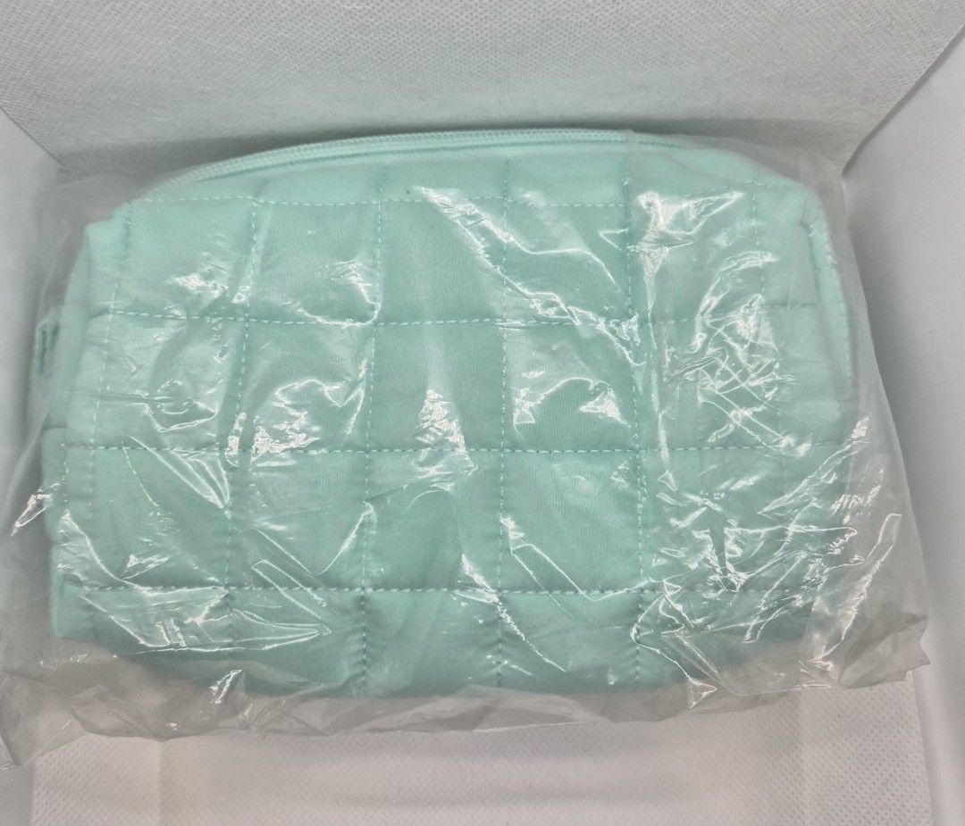 Coconut Matter Quilted Mint Green Makeup Pouch (Category: Purses & Pouches) located in Manila. Submitted by prelovedbyc.hannah (Listing ID 1470357994, Image 2). Description: - Brand: Coconut Matter - Color: Mint green - Material: 100% recycled plastic bottles (6 bottles used) - Design: Soft quilted fabric with top zipper closure - Use: Ideal for makeup, toiletries, or daily essentials - Condition: Brand new, still sealed in original plastic packa