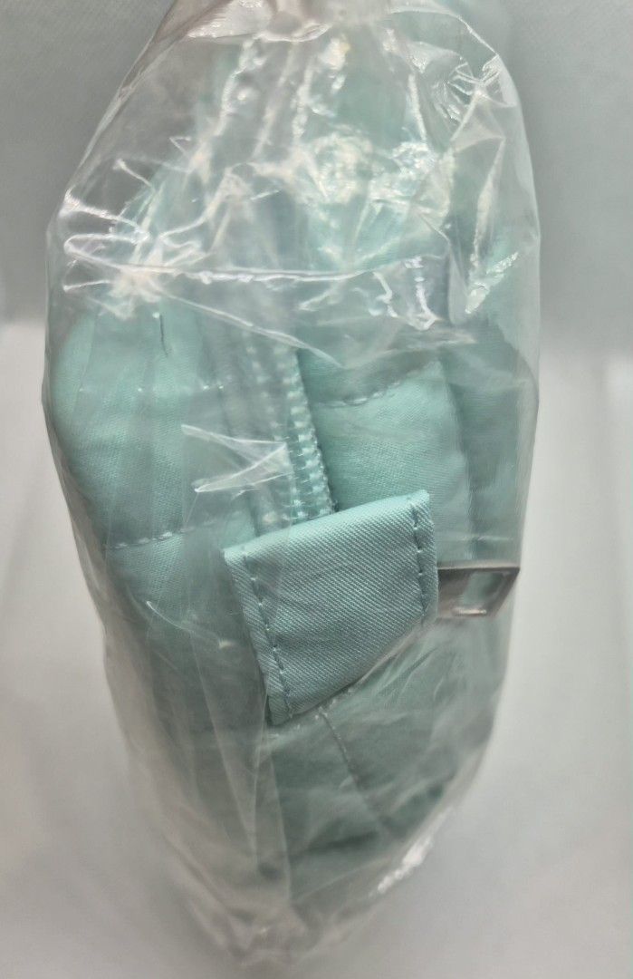 Coconut Matter Quilted Mint Green Makeup Pouch (Category: Purses & Pouches) located in Manila. Submitted by prelovedbyc.hannah (Listing ID 1470357994, Image 3). Description: - Brand: Coconut Matter - Color: Mint green - Material: 100% recycled plastic bottles (6 bottles used) - Design: Soft quilted fabric with top zipper closure - Use: Ideal for makeup, toiletries, or daily essentials - Condition: Brand new, still sealed in original plastic packa