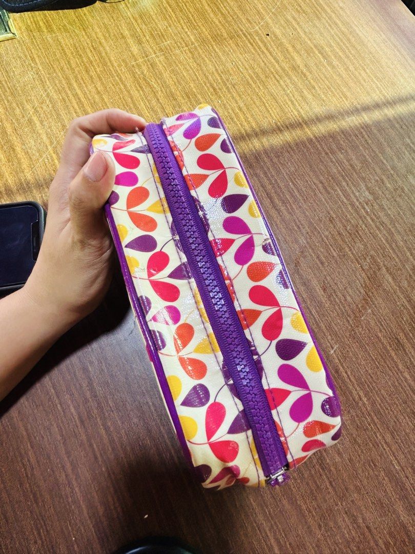 Colorful Leaf Pattern Cosmetic Pouch (Category: Purses & Pouches) located in Manila. Submitted by starbalesukandjapansurplus (Listing ID 1470555591, Image 3). Description: - Design: Multi-colored leaf print with a classy cream base - Accents: Eye-catching purple zipper tape and matching pull tab - Structure: Rectangular shape with reinforced piping along the edges - Material: Easy-to-clean glossy finish - Capacity: Roomy interior, perfect for dai